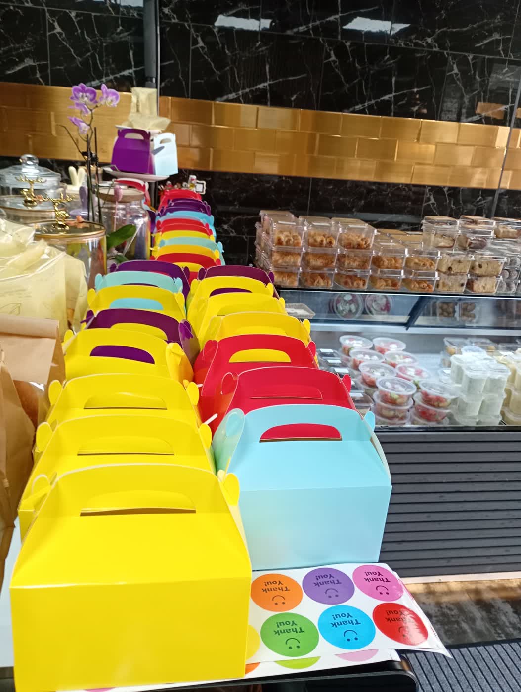 Colourful thank-you boxes lined up for the performers.